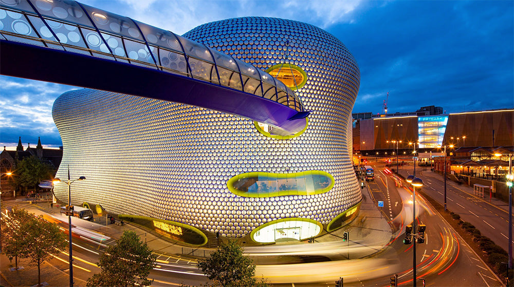 The Bullring & Grand Central in Birmingham is a premier, iconic shopping and leisure destination, attracting over 40 million visitors annually. Reopened in 2003 after a £500 million transformation, it features over 160 shops and restaurants across two main buildings, the East and West Malls, connected by a dramatic 7,000 m² glass "SkyPlane" roof. The centre is famed for the futuristic, 15,000-aluminum-disc-covered Selfridges building and the 7-foot bronze Bull statue.
