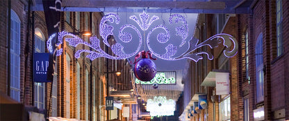 Decorative LED lights signage over the walkway at Gloucester Quays Christmas Market