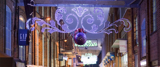 Decorative LED lights signage over the walkway at Gloucester Quays Christmas Market
