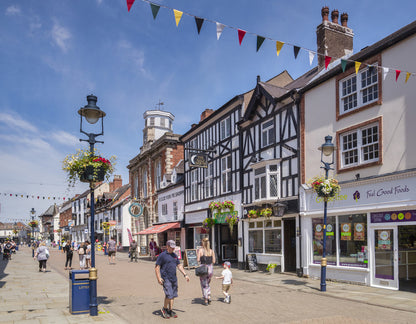 Melton Mowbray high street is a bustling, historic, and quintessentially English market town centre, characterized by charming older buildings, a lively atmosphere, and a strong food focus. It serves as a, central hub for local shopping, featuring traditional pork pie shops, artisan food retailers, cafes, and easy access to the adjacent vibrant market.