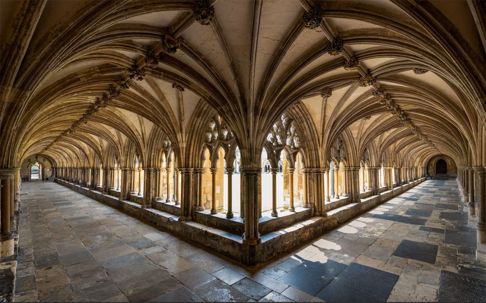 The cloisters at Norwich Cathedral are the largest monastic cloister in England, featuring stunning, high-vaulted ceilings and extensive medieval roof bosses. The corridors exhibit a mix of early English Gothic style with pointed arches and unique, carved stone details. The walkways, which connect to the Refectory, Hostry, and Library, also contain a central labyrinth created for the Queen’s Golden Jubilee.