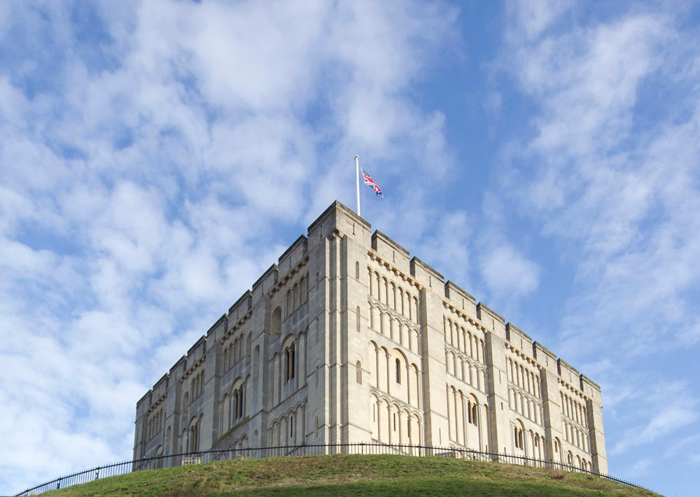 Norwich Castle is a 12th-century Norman royal fortress in Norfolk, England, originally built by William the Conqueror to secure power. Reopened after a major redevelopment, the stone keep is now a fully accessible museum and art gallery offering immersive 12th-century palace displays, fine art, archaeology, and panoramic rooftop views.