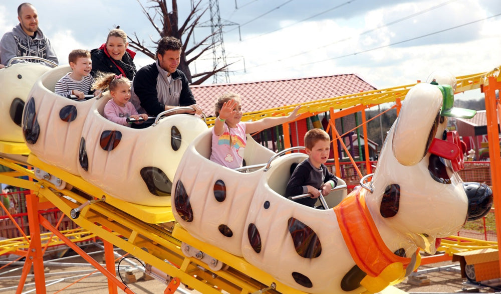 People on a roller coaster at Old Mac Donald's Farm amusement park. Old MacDonald's Farm & Fun Park in Brentwood, Essex, is a popular children's farm and amusement attraction designed for families with children under 12. It features a variety of farm animals and exotic animals, including petting, feeding, and educational experiences, alongside family-friendly rides, indoor soft play, and outdoor adventure play.