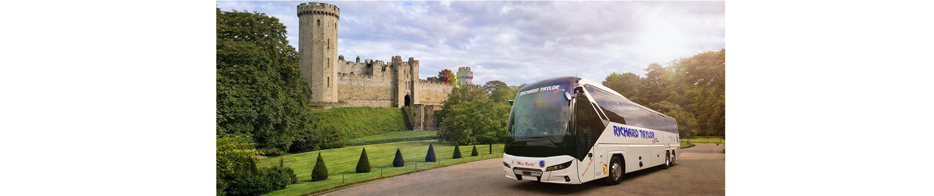 Richard Taylor Travel - Private Hire Coach on a road with a castle in the background