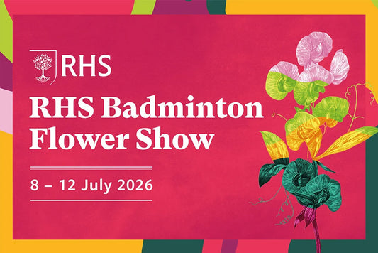 Promotional poster for RHS Badminton Flower Show with colourful flowers on a pink background. The RHS Badminton Flower Show is a new, major horticultural event debuting from July 8–12, 2026, on the historic Badminton Estate in Gloucestershire. It will feature RHS Artisan Gardens, over 80 specialist nurseries, live demos, and an "Allotment Borders" theme, celebrating the estate's rich gardening heritage.