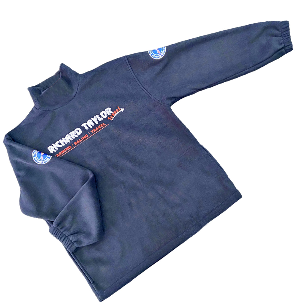 Richard Taylor Travel navy blue long-sleeve fleece pullover sweatshirt with 'RICHARD TAYLOR TRAVEL' logo printed in white and red on the back, and a circular blue and white patch on the sleeve, shown on a plain white background.