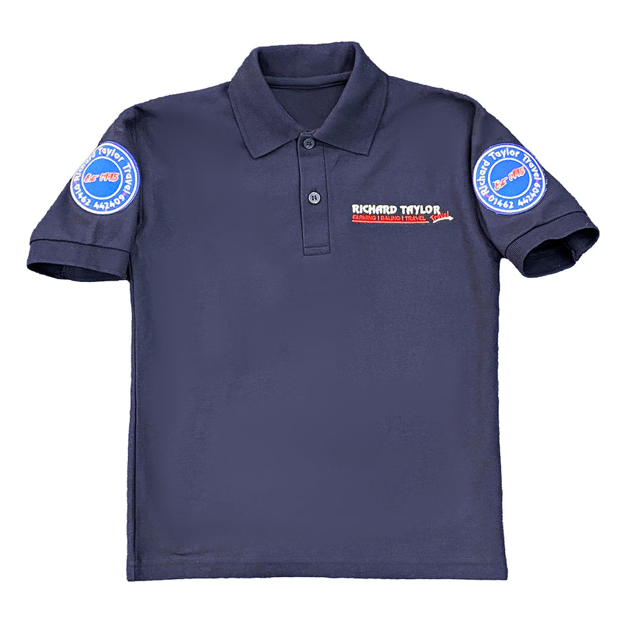 Richard Taylor Travel navy blue short-sleeve polo shirt with a collar and button placket, featuring a 'Richard Taylor Travel' embroidered logo on the left chest and circular patches on both sleeves, shown against a plain white background.