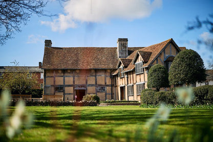 Shakespeare’s Birthplace on Henley Street in Stratford-upon-Avon is a restored 16th-century half-timbered house where William Shakespeare was likely born in 1564 and raised. It is a two-story building featuring a parlor with a fireplace, a large kitchen with an open hearth, and a dedicated glove-maker’s workshop, reflecting the family's status.