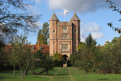 Sissinghurst Castle entrance, located in Kent, England, is a world-renowned, romantic garden designed by Vita Sackville-West and Harold Nicolson in the 1930s within the ruins of an Elizabethan manor. Known for its intimate "garden rooms" separated by high hedges and brick walls, it features the iconic White Garden and a towering Tudor gatehouse.
